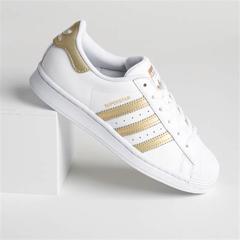 Adidas tennis shoes gold